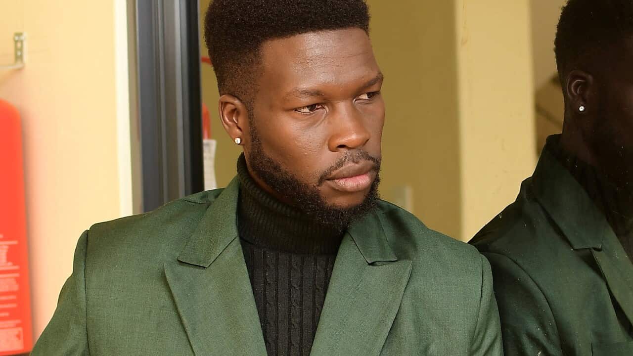 A man posing for a photo.