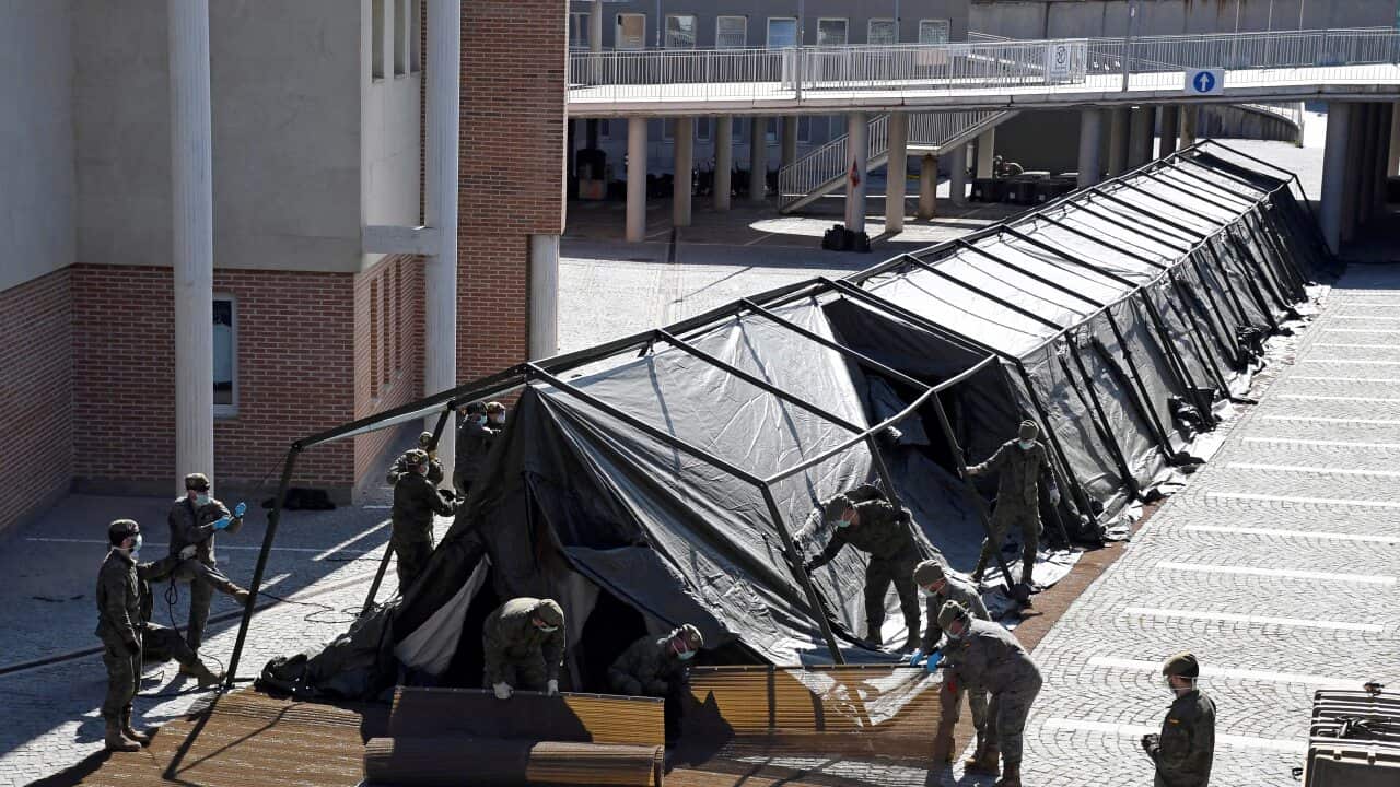 Spain's ground army engineers build a tent for a field hospital next to the Segovia Hospital in Segovia, Spain