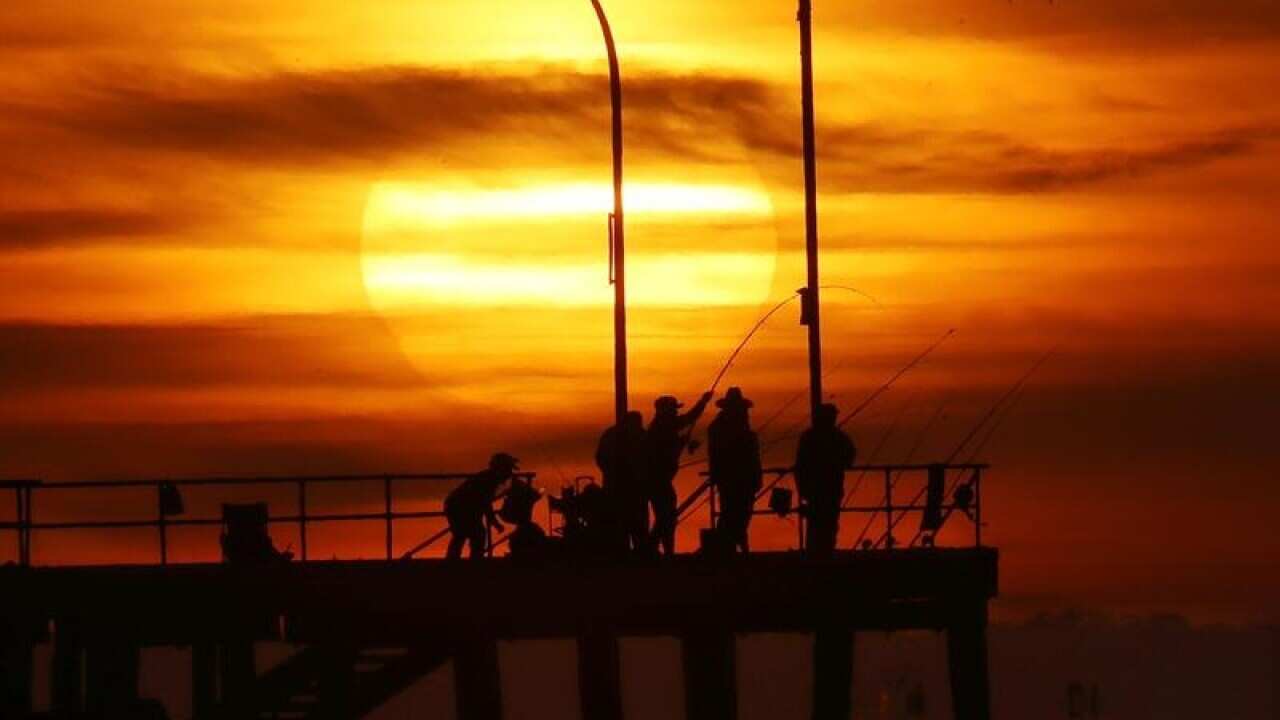Sunrise over Altona pier in Melbourne.