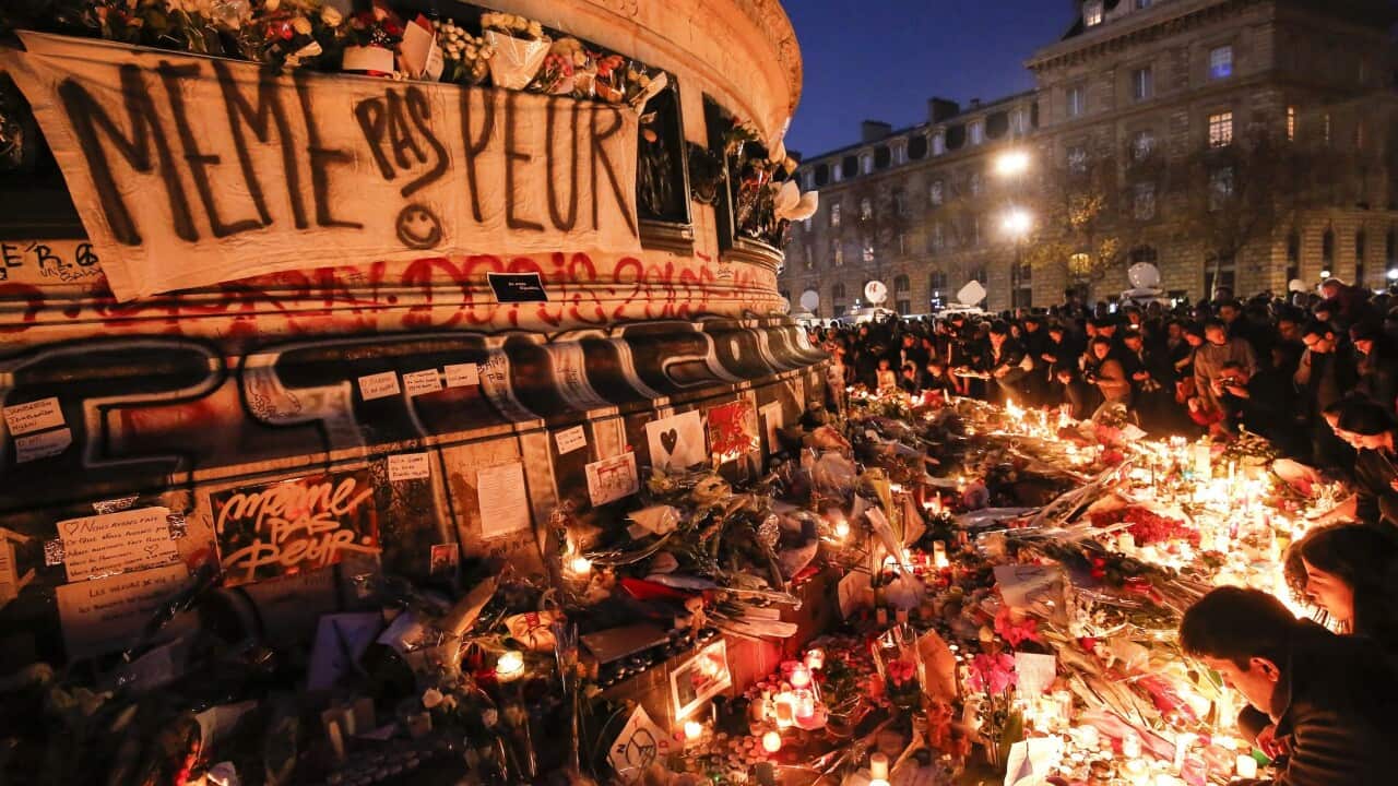 A sign at a memorial at Place de la Republique square in Paris reads, in French, 'Not Even Afraid'.