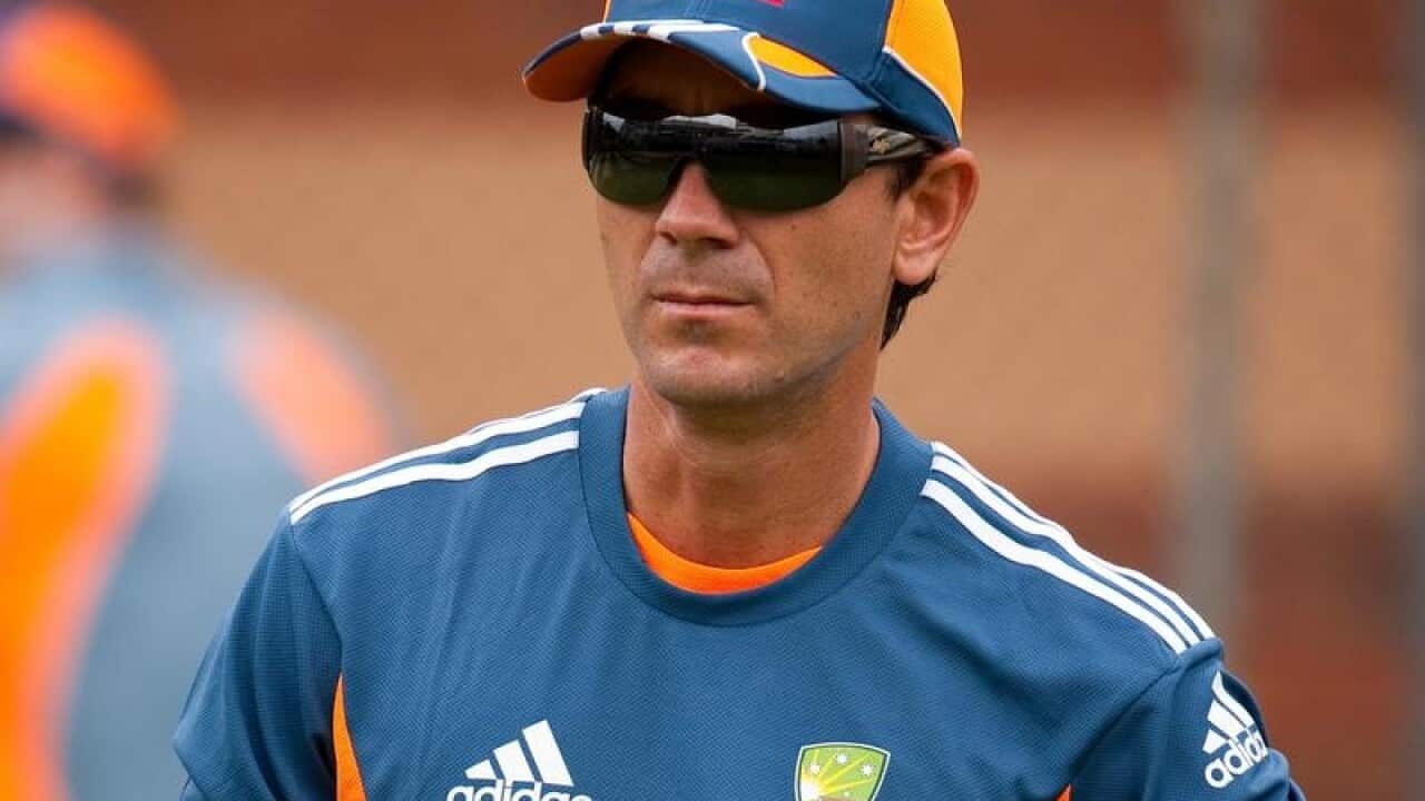Justin Langer looks on