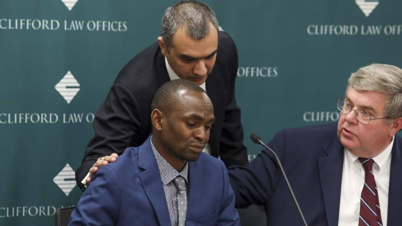 Paul Njoroge is comforted by Manant Vaidya - both men lost family in the Ethiopian Airlines crash.