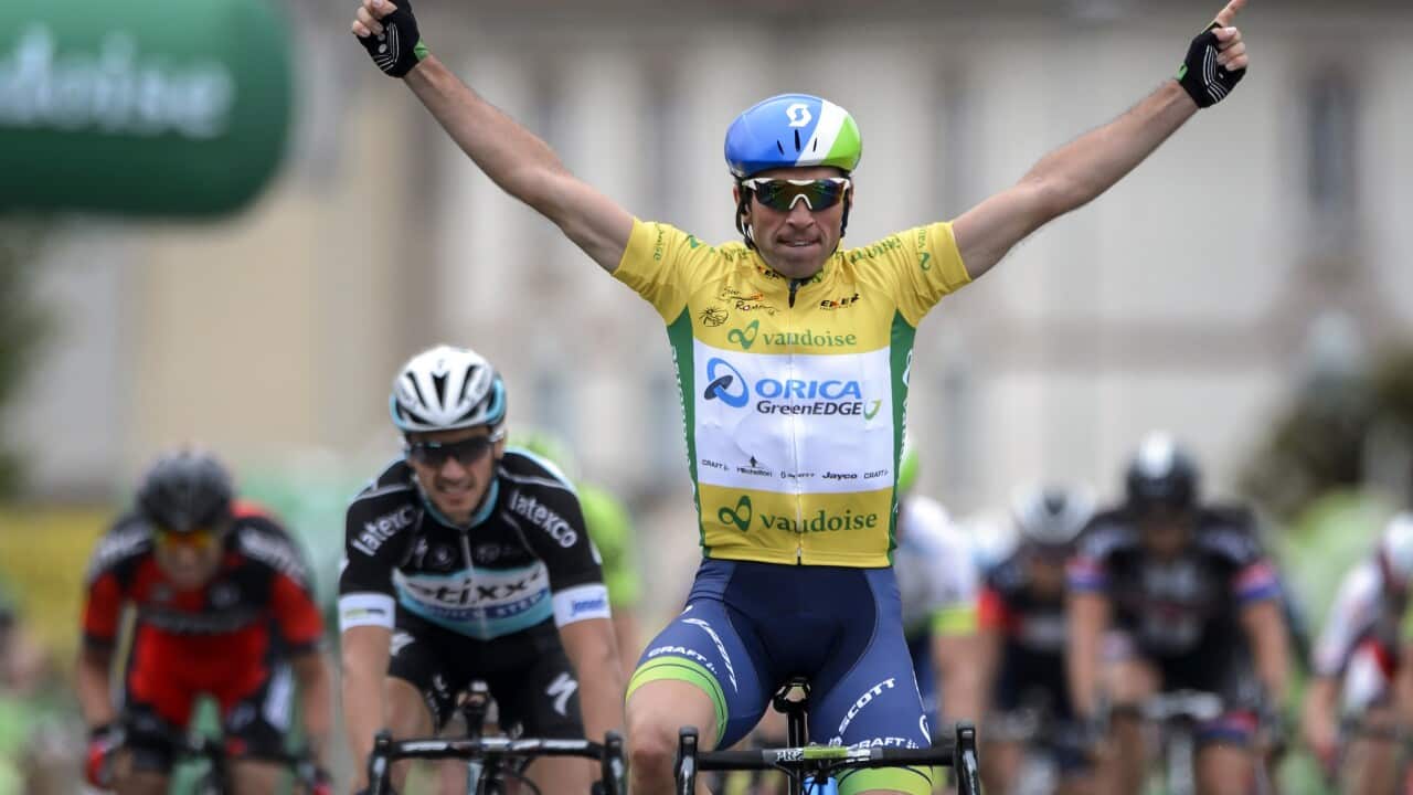 Overall leader Swiss Michael Albasini (Orica GreenEdge) celebrates after winning the third stage 172.5 km between Moutier and Porrentruy at the Tour de Romandie