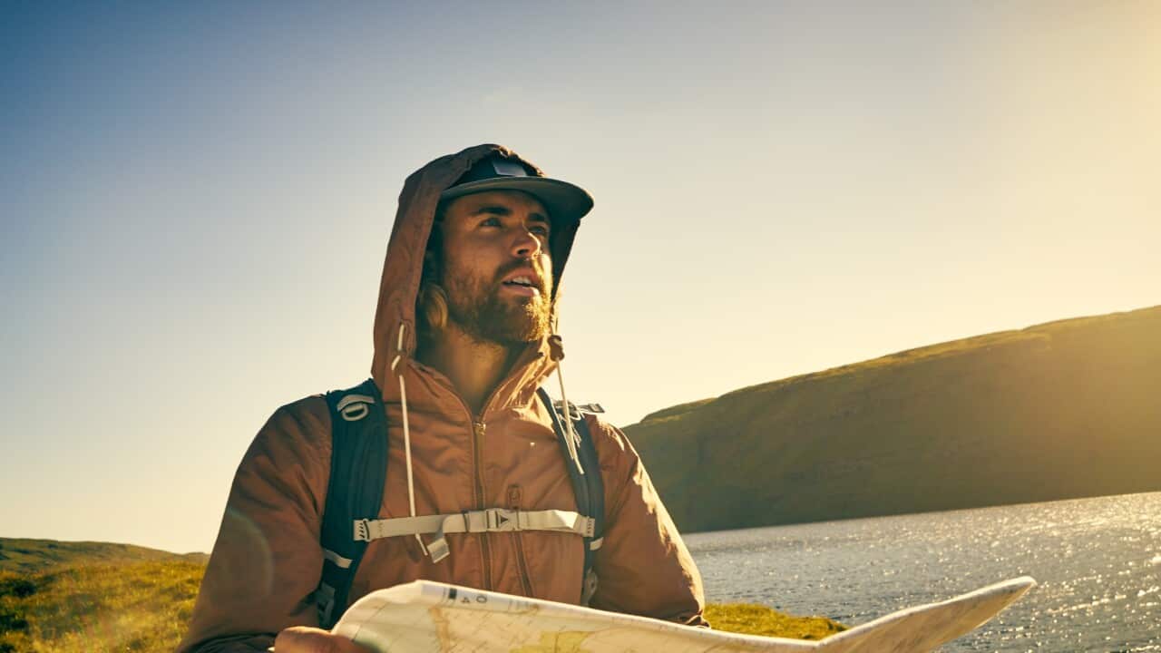 Bushwalker with map_pixdeluxe Getty.jpg