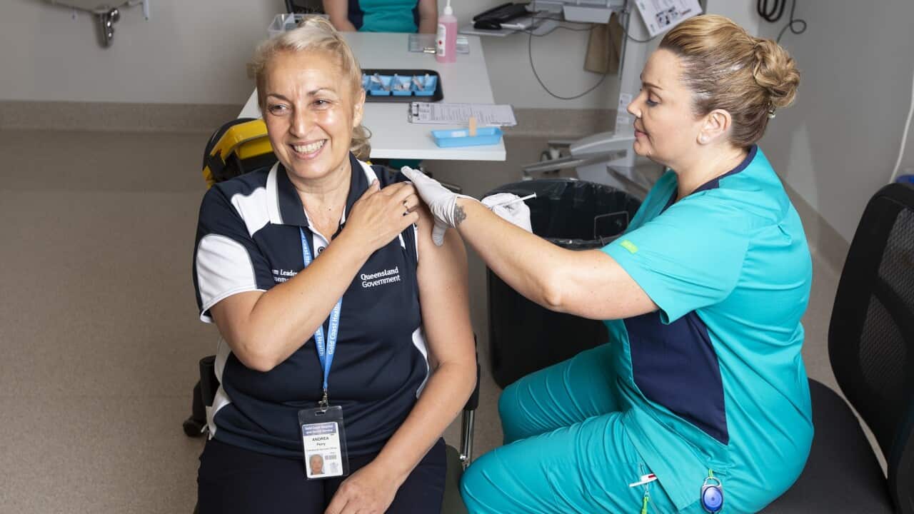 A frontline worker receives the COVID-19 vaccine at Gold Coast University Hospital in Queensland