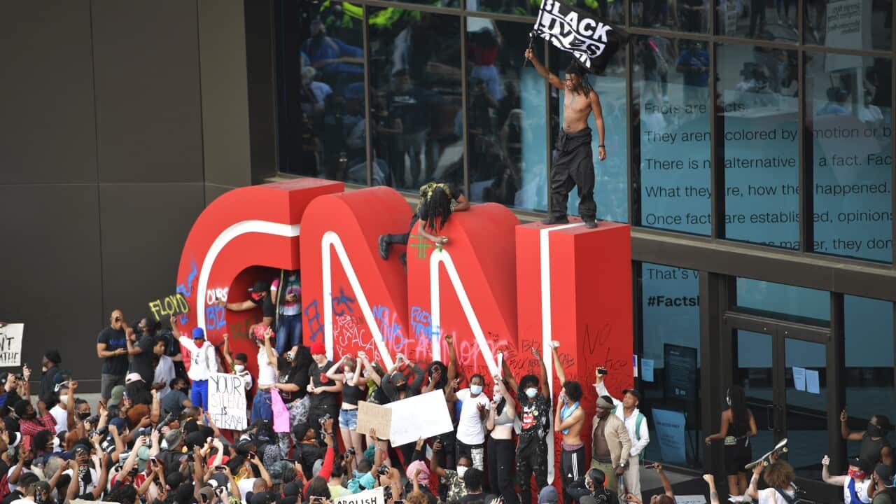 Demonstrators gather outside the CNN building during a George Floyd protest in Atlanta. 