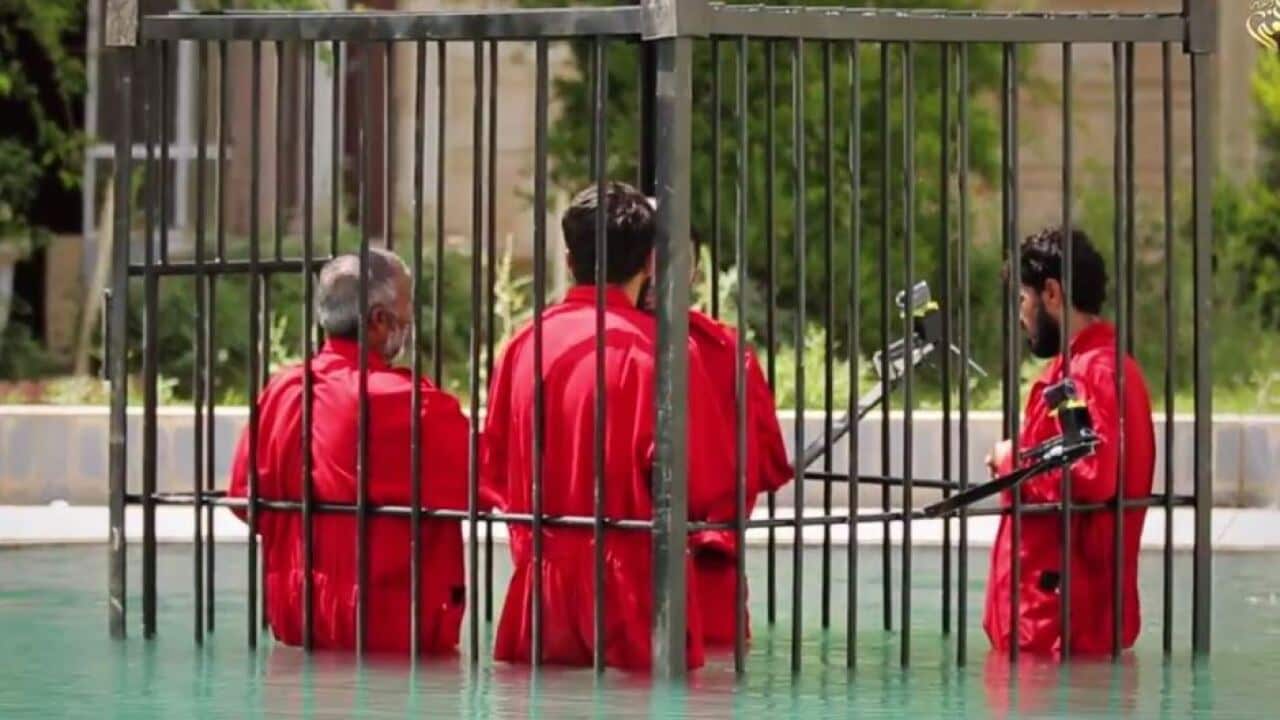 Video shows IS drowning men in a cage
