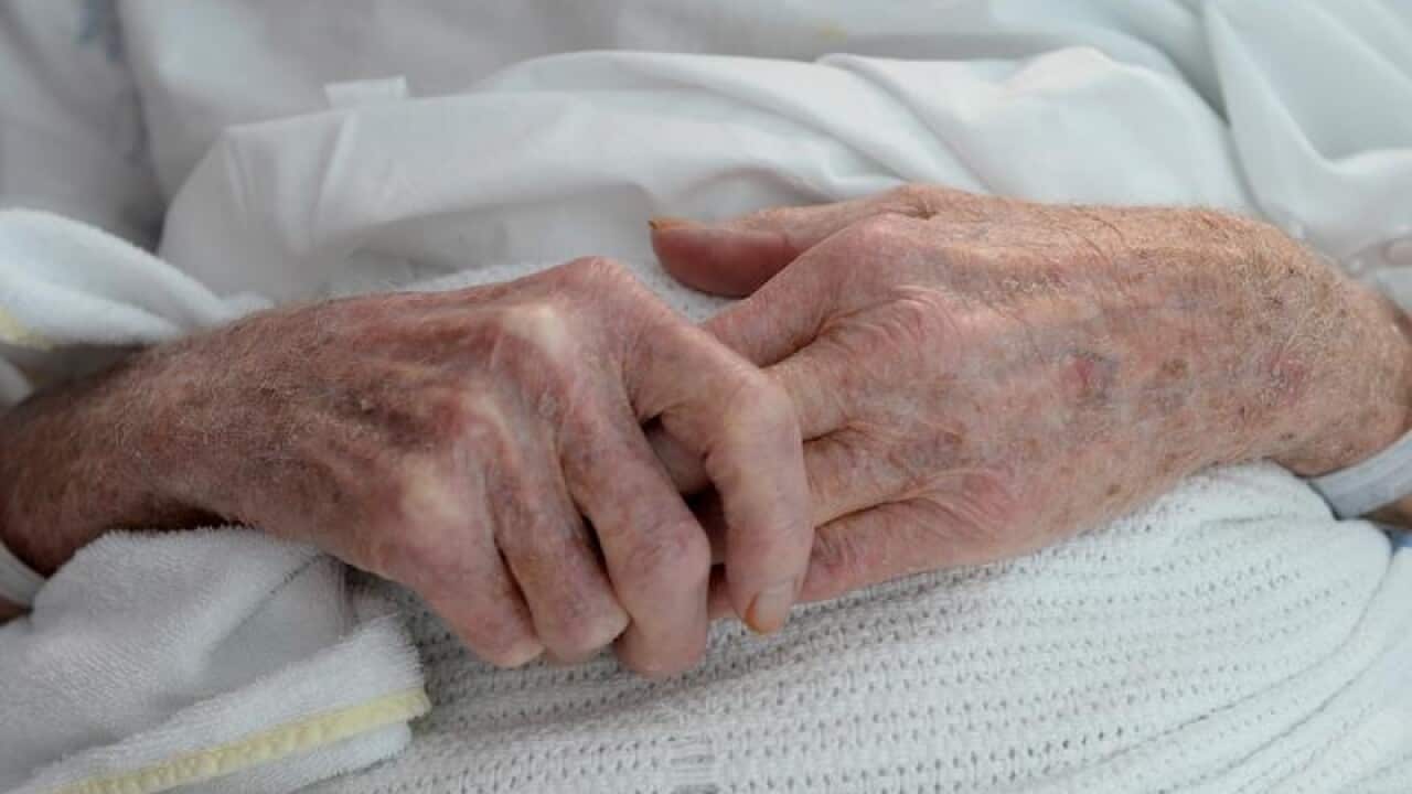 An elderly patient's hands