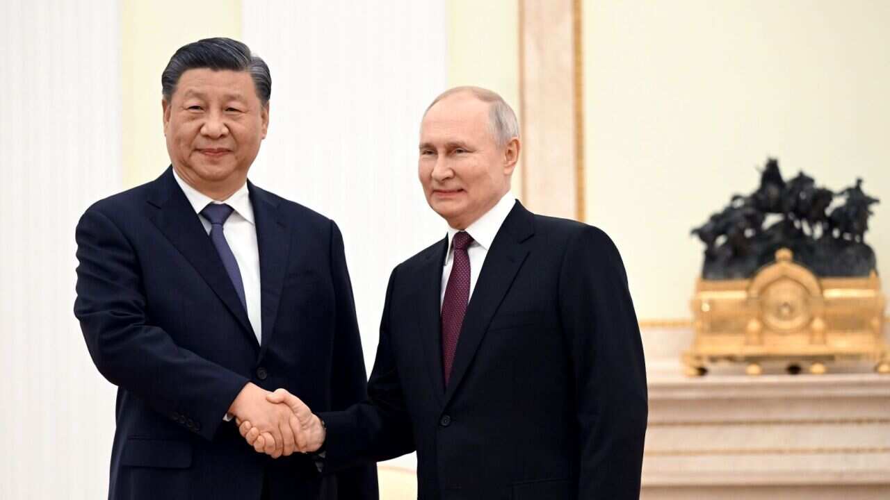 The leaders of China and Russia shake hands (AAP).jpg