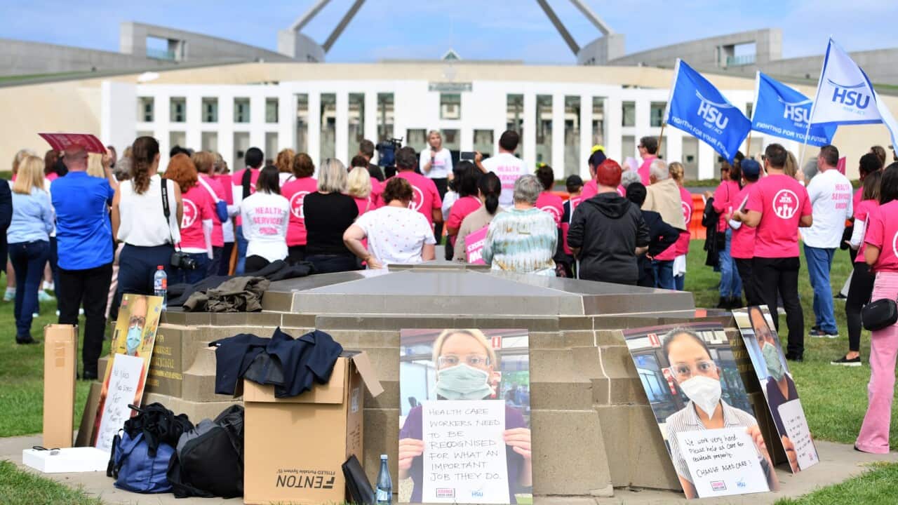 Aged care workers are seen protesting outside Parliament in March