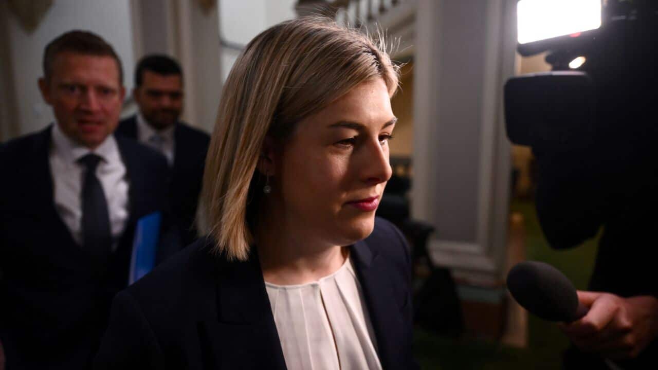 A woman with short blonde hair.