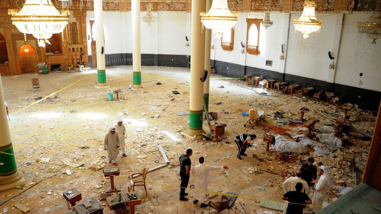 Medics and security forces gather inside Imam Sadiq Mosque following a suicide bombing in al-Sawaber, Kuwait City, Kuwait, 26 June 2015. (EPA/RAED QUTENA)