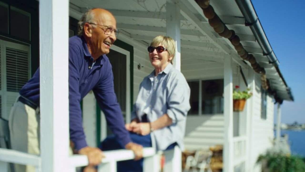 Couple on porch when holidaying