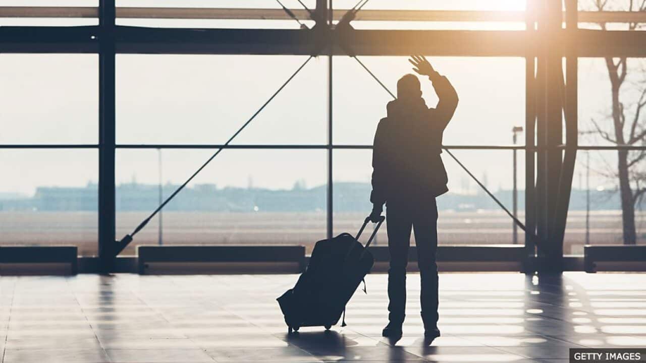 Waving goodbye at the airport