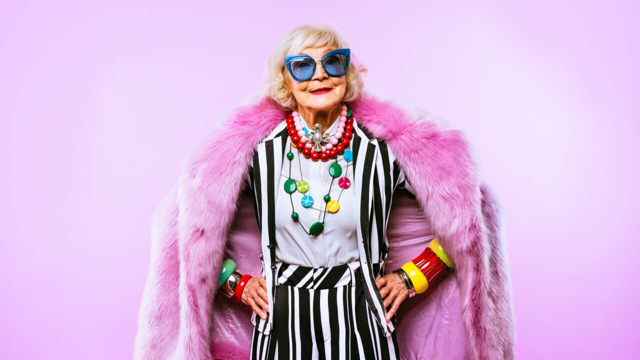 Portrait Of Senior Woman Against Colored Background