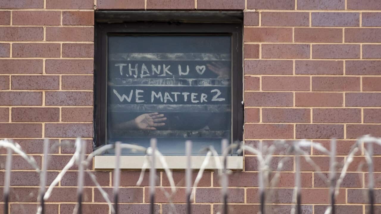 Inmates inside Cook County Jail post messages in the window during the coronavirus pandemic