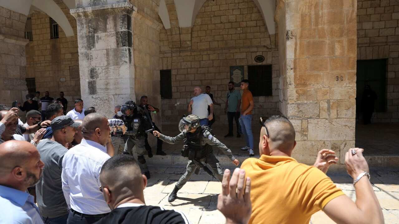A confrontation between Israeli border police and Muslim worshippers gathered for Friday prayers at Al-Aqsa Mosque on 14 May 2021.
