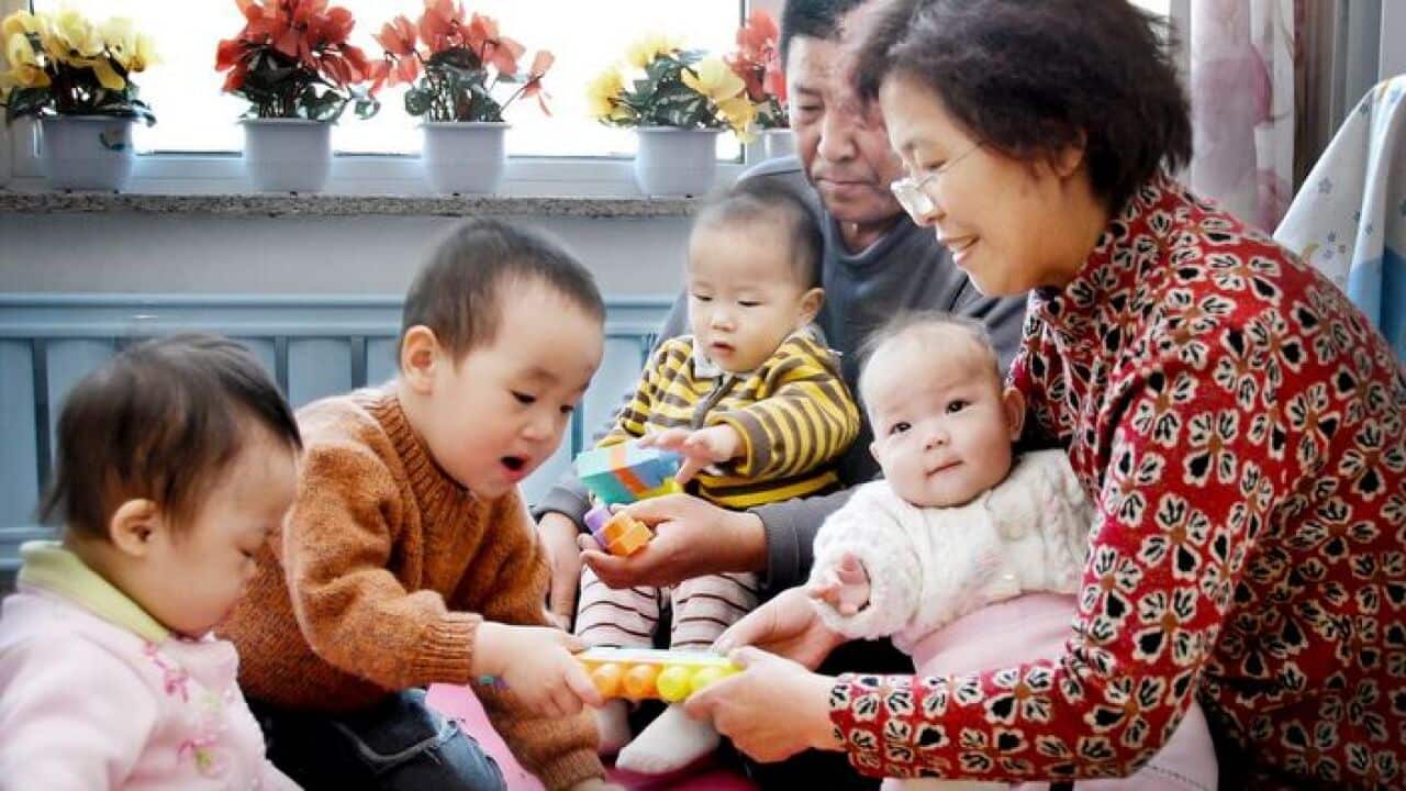 Chinese Family taking care of orphans at home