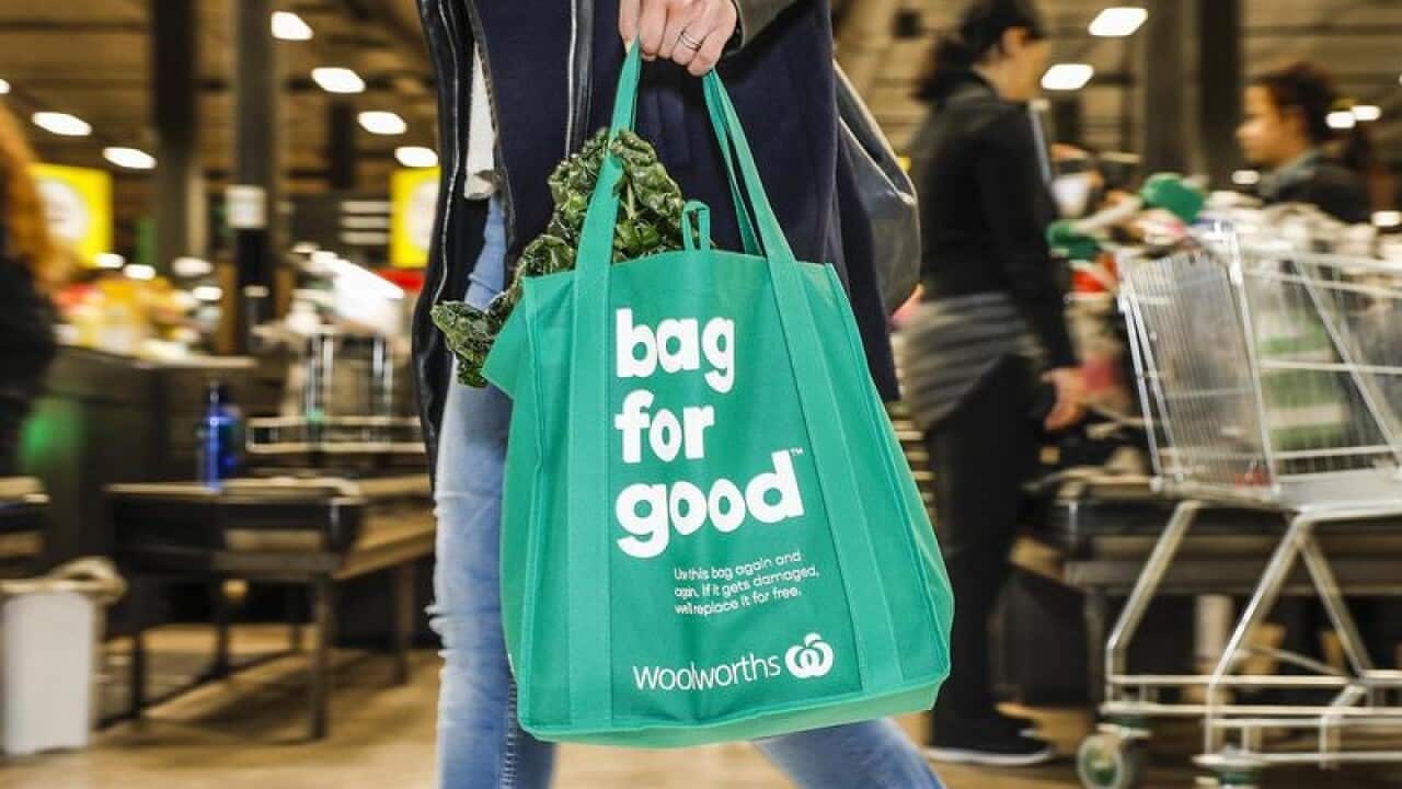 Woolworths' first-half profit edged up one per cent to $979 million