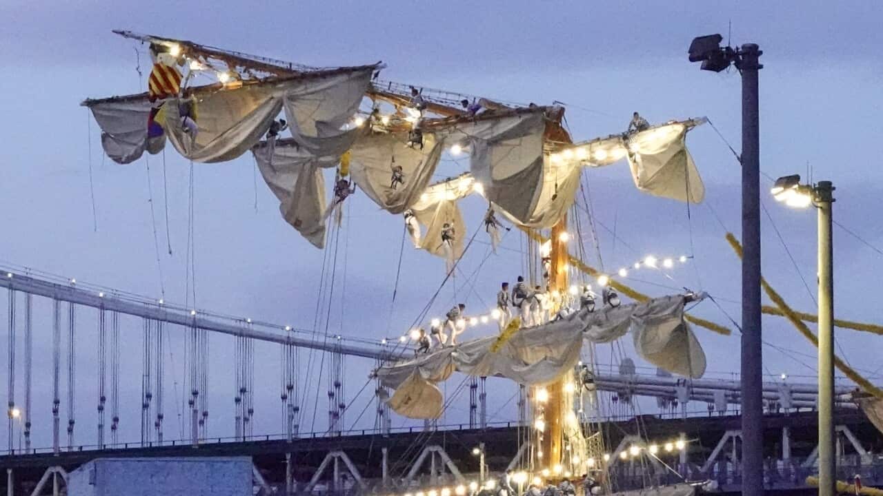 Sailors on the masts of the Cuauhtemoc, a Mexican Navy training boat, as it sits in the East River after the ship hit the Brooklyn Bridge