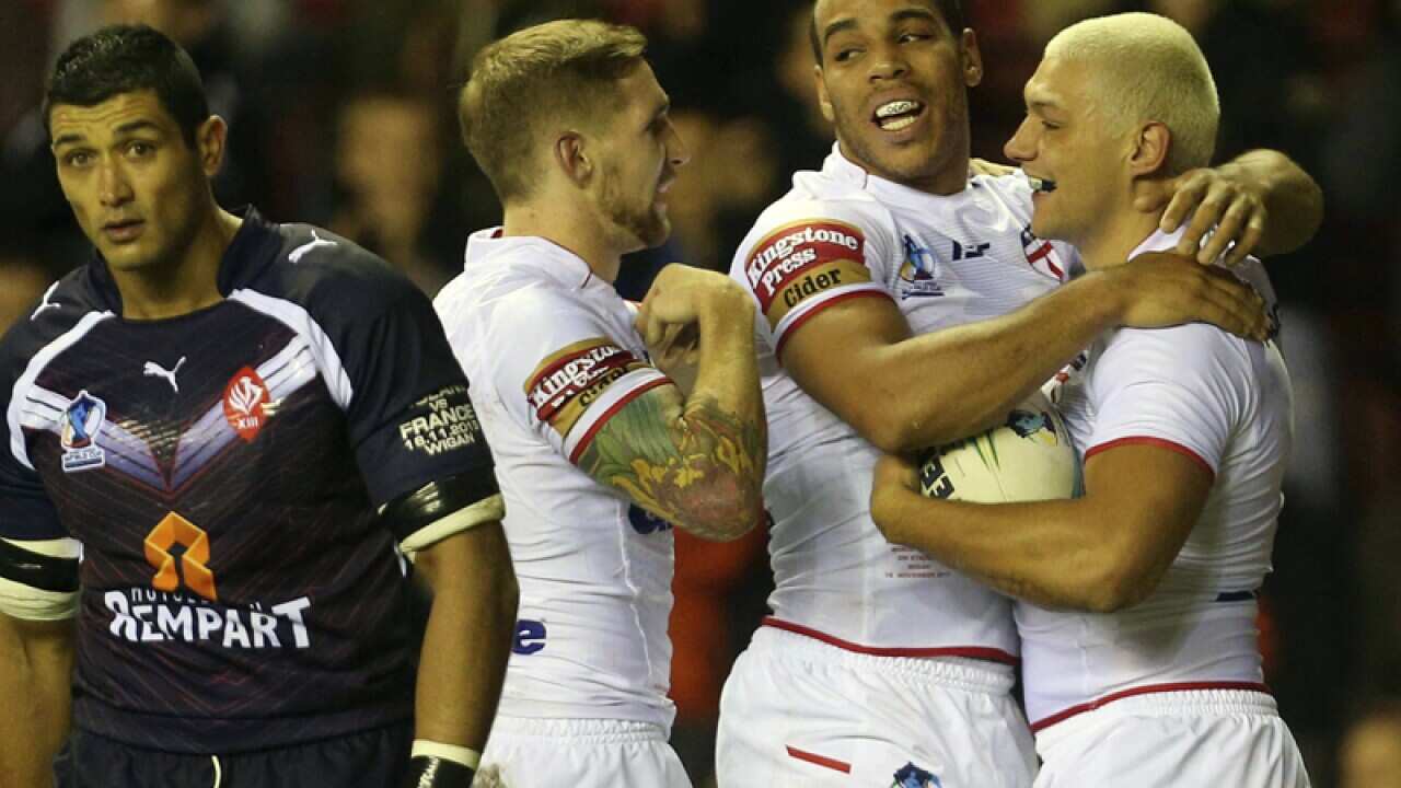 England's Ryan Hall (R) celebrates scoring against France