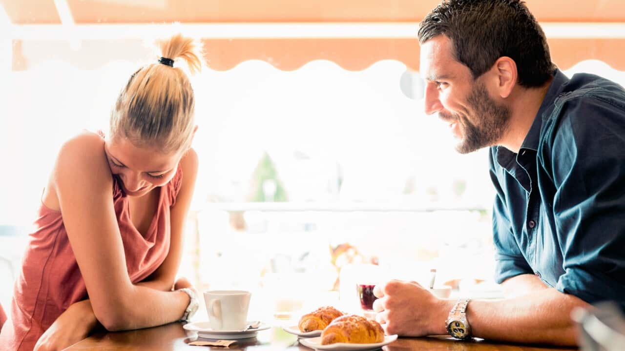 Young couple has breakfast at italian CAFE
