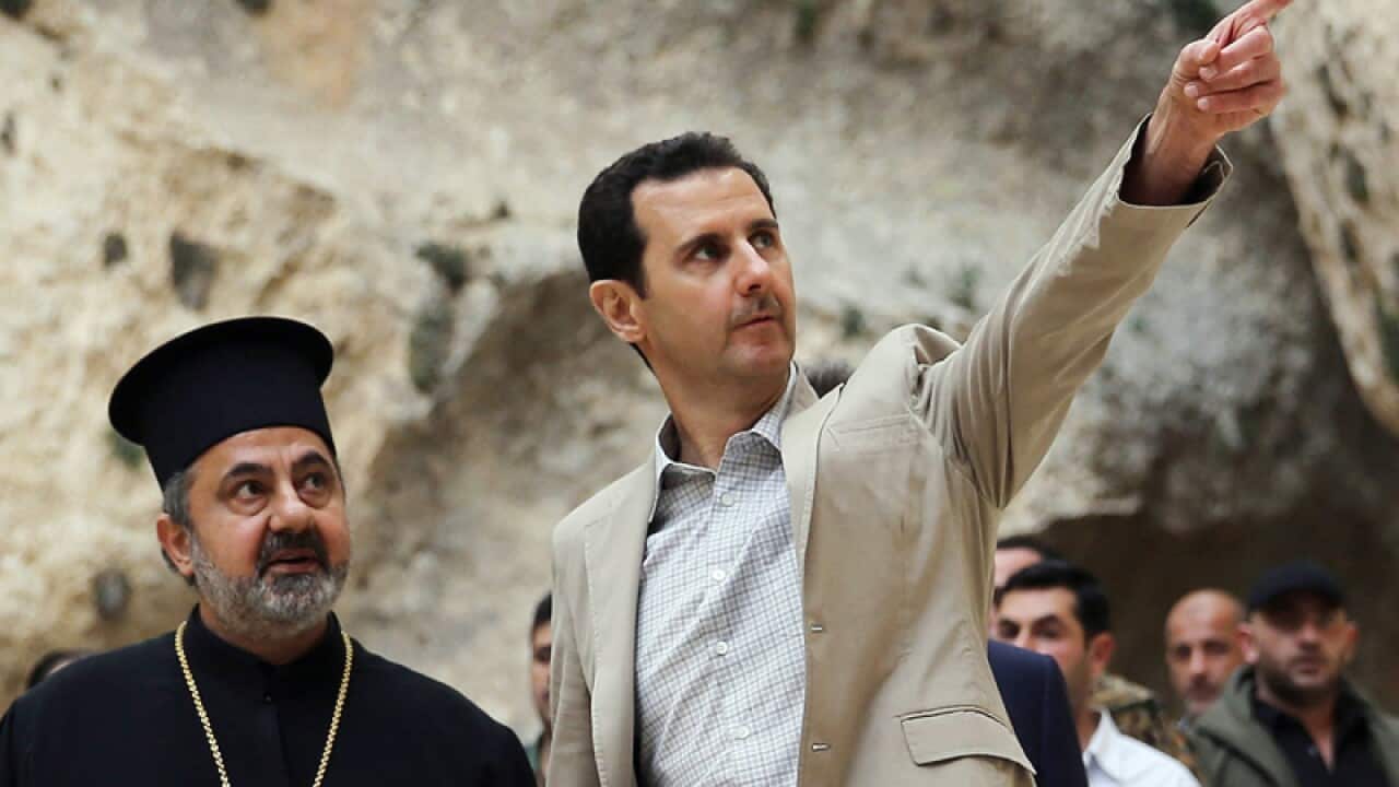 Syrian president Bashar al-Assad (R)