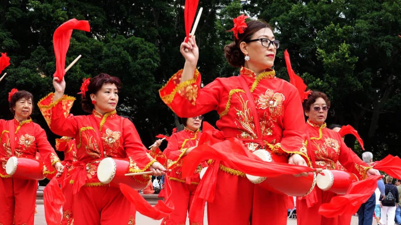 Asian Women at Work drumming group perform part in the Sydney International Women's Day March 'Stop the Silence! End the Violence!'