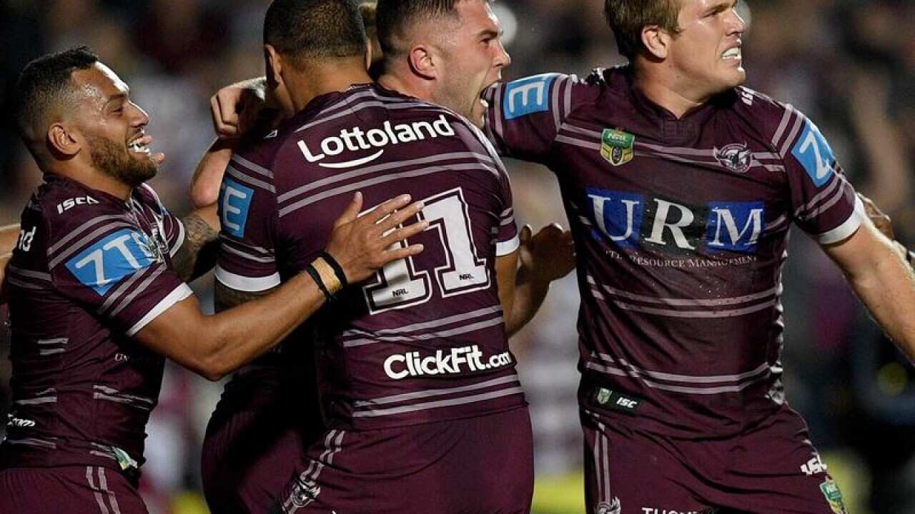Curtis Sironen with team mates after scoring a try during the Round 26