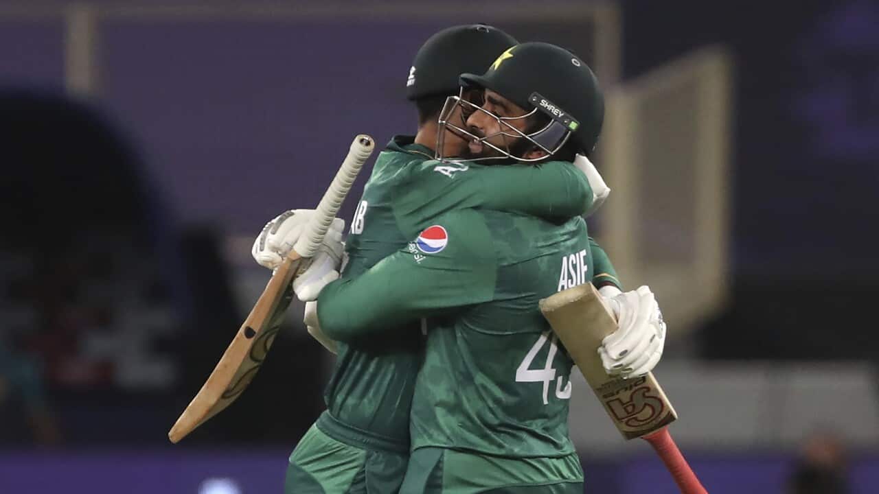 Pakistan's Asif Ali, right, hugs batting partner Shadab Khan to celebrate their win in the Cricket Twenty20 World Cup match against Afghanistan in Dubai, UAE, Friday, Oct. 29, 2021. (AP Photo/Aijaz Rahi)