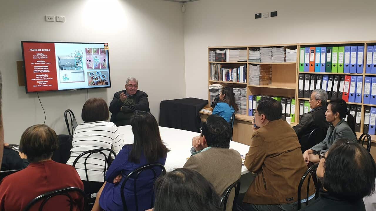 Rudolf Kotik, top of the photo, presents franchise opportunities