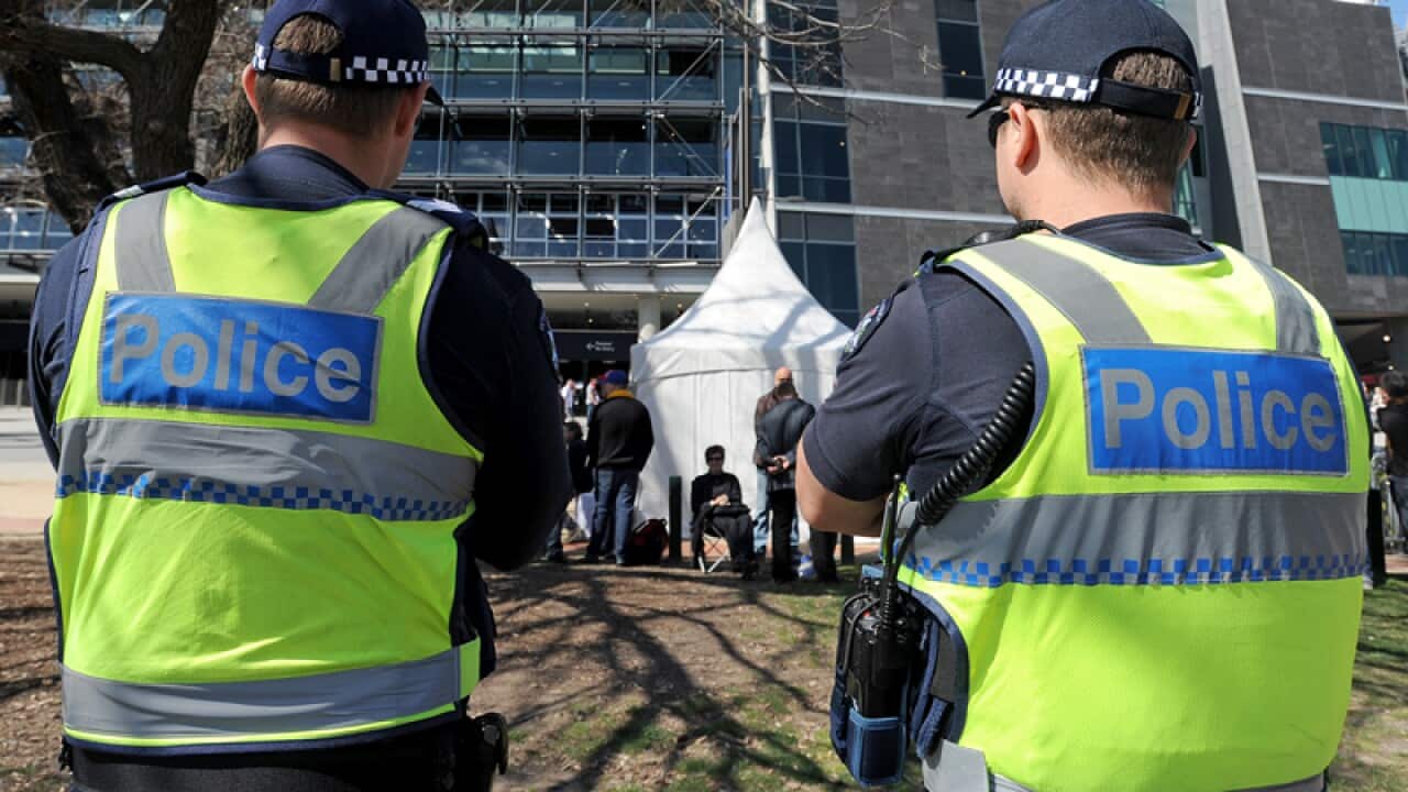 Victoria Police officers outside the Melbourne Cricket Ground