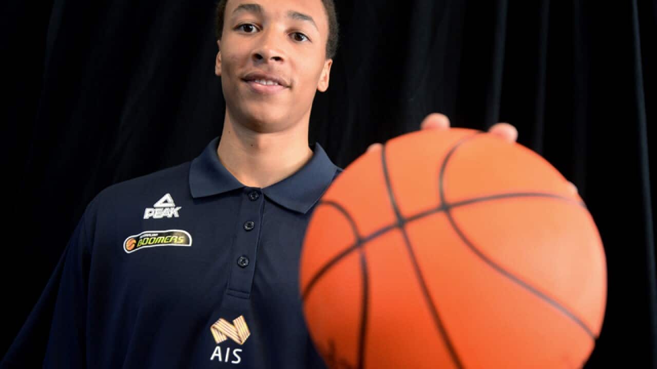 Dante Exum poses for a portrait.
