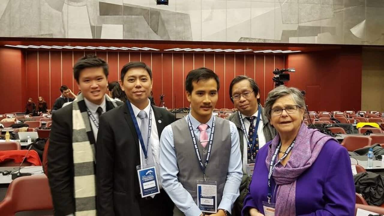 Nguyen Trung Trong Nghia with pink tie in Geneva coference, Switzeland