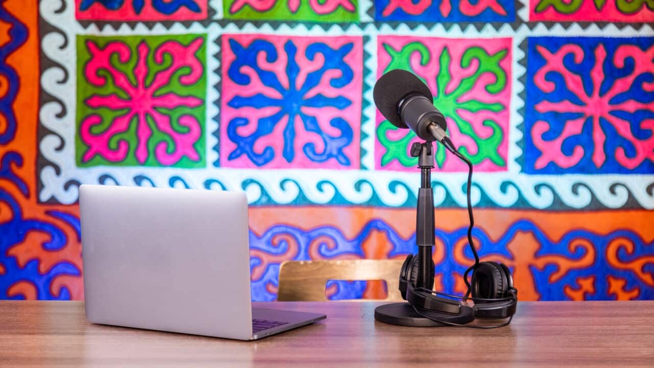 Microphone, headphones and laptop equipment for podcast recording