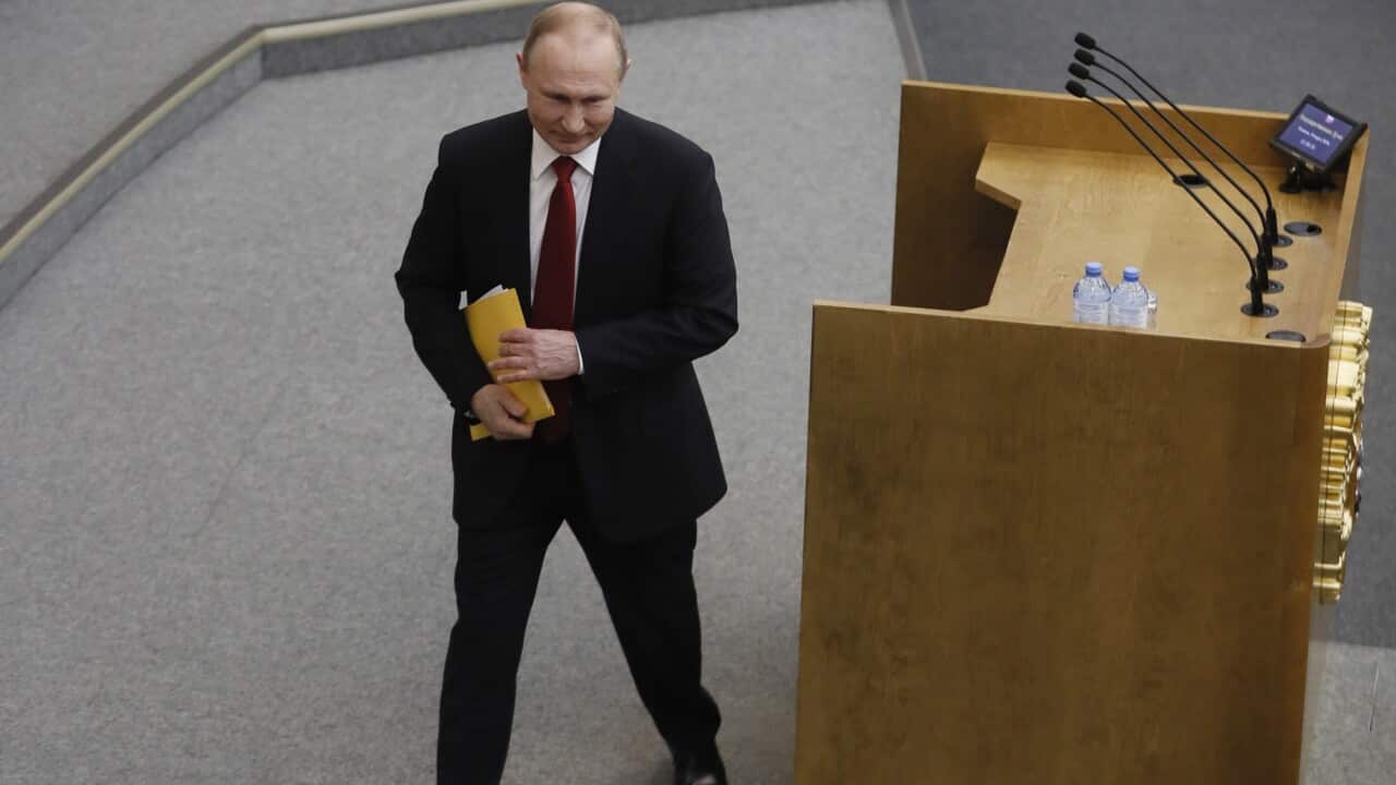 Russian President Vladimir Putin departs after delivering a speech to the State Duma (the lower house of Russia's Federal Assembly) in Moscow.