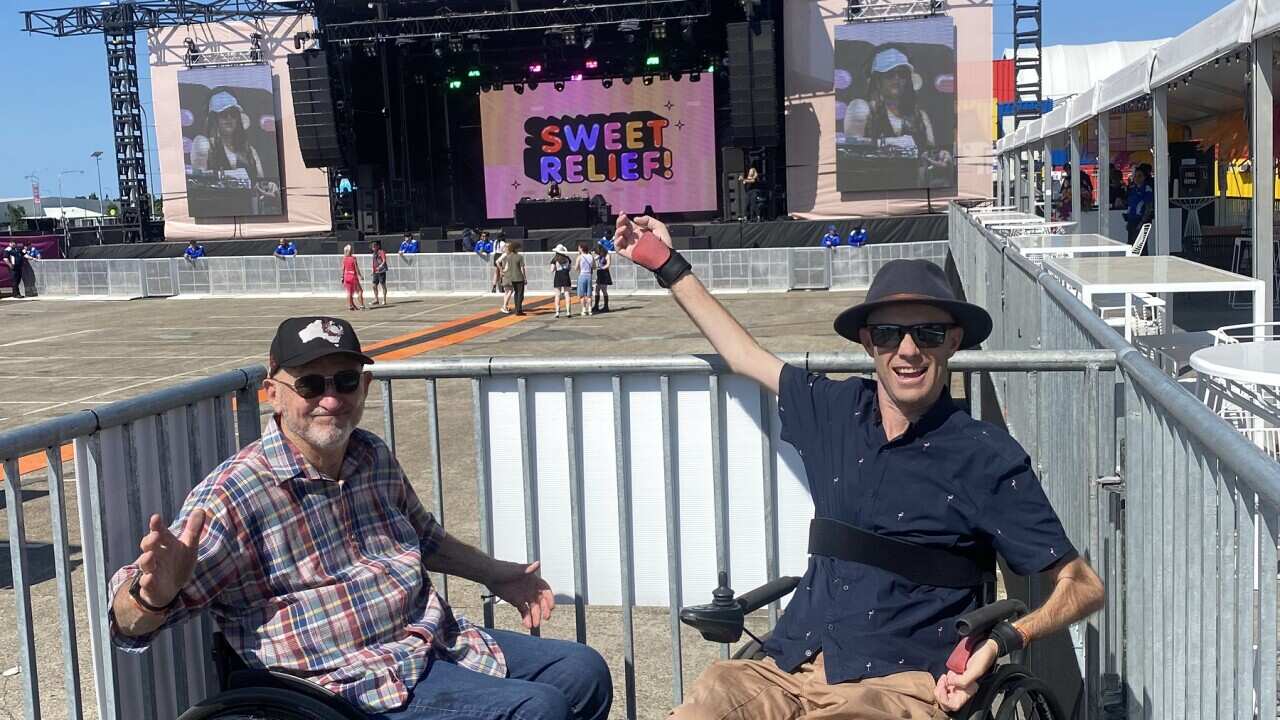 Spinal Life Australia's Senior Advisor Dane Cross at a Sweet Relief! Festival with his friend (SBS).jpg