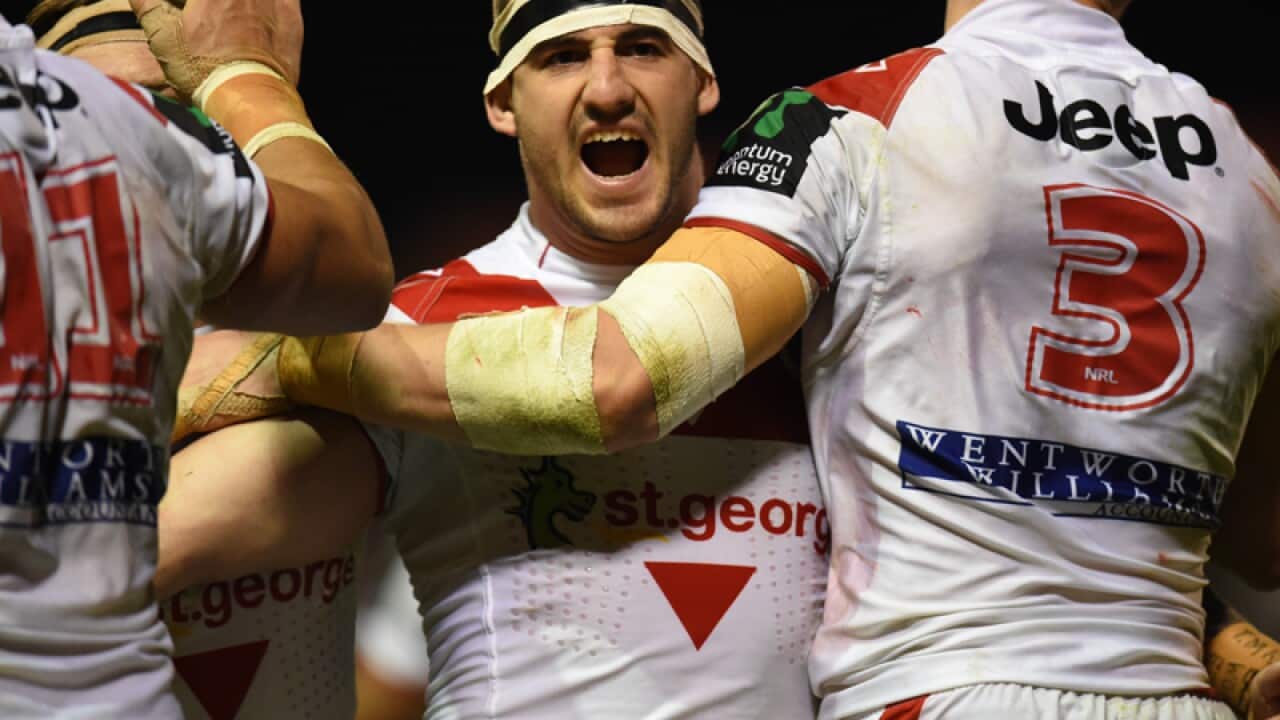 Dragons' Jacob Marketo of the Dragons celebrates with team mates