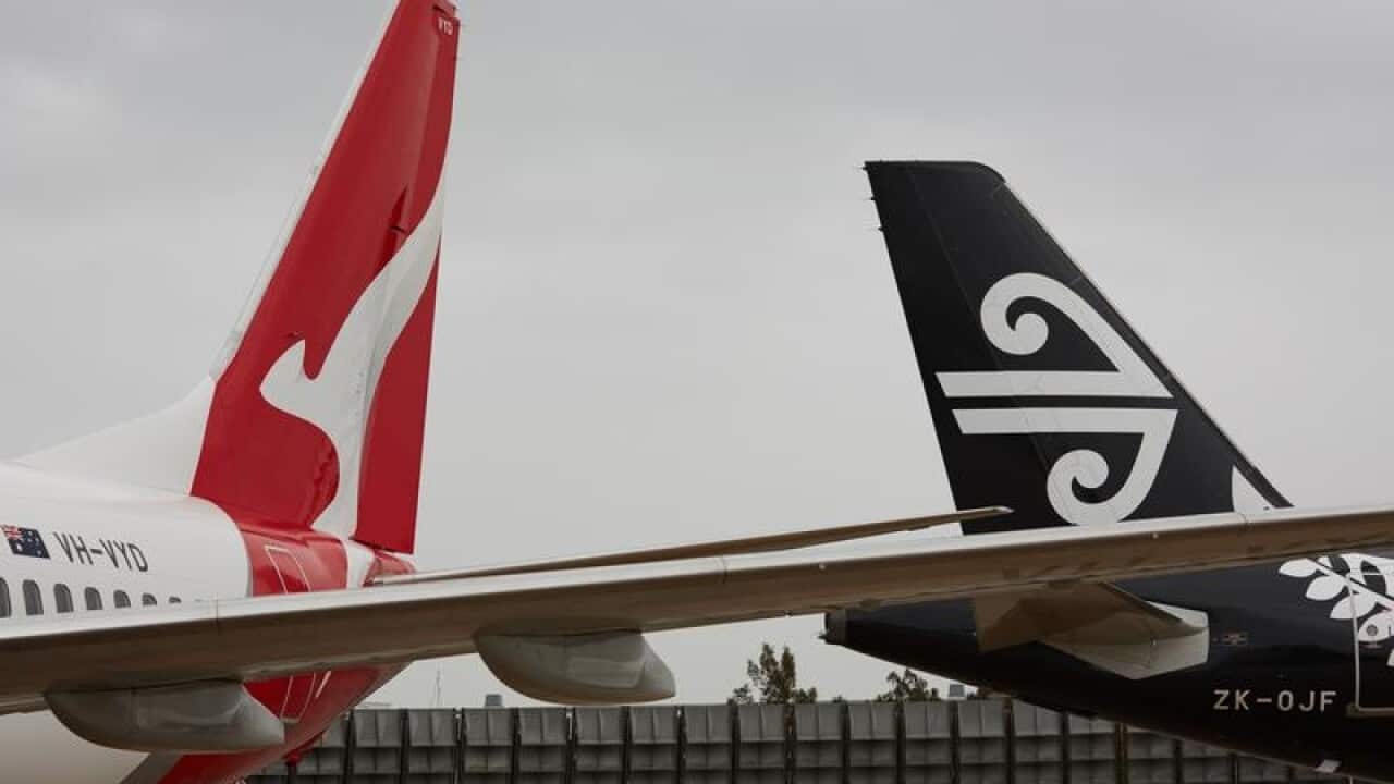 Qantas and Air New Zealand planes during a press conference at Sydney.