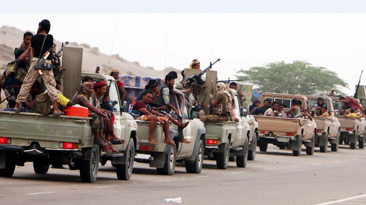 Yemeni forces backed by the Saudi-led coalition take position during an attack on the port city of Hodeidah.