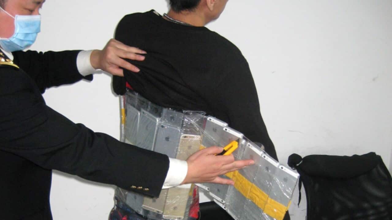 A Hong Kong man with 94 smartphones strapped to his body
