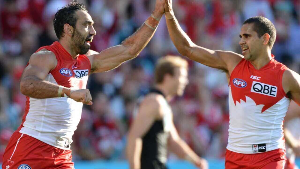 Swans' Adam Goodes celebrates another goal with Lewis Jetta