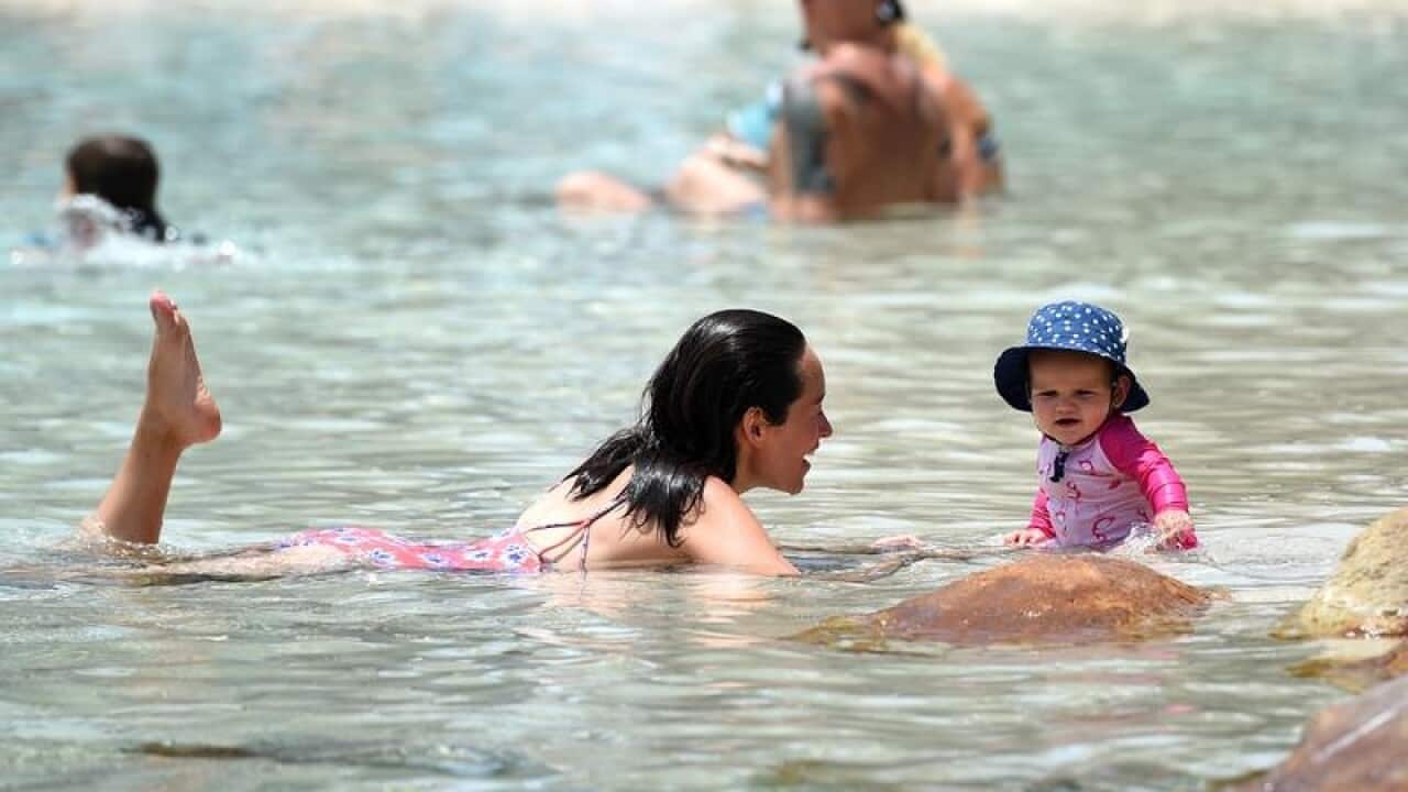 A young mother and her baby escape the heat at the Southbank.