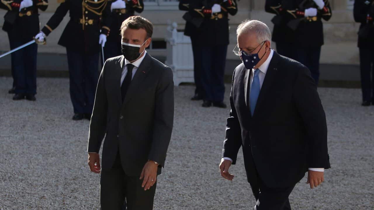 French President Emmanuel Macron welcomes Australian Prime Minister Scott Morrison before a working dinner in Paris on 15 June, 2021.