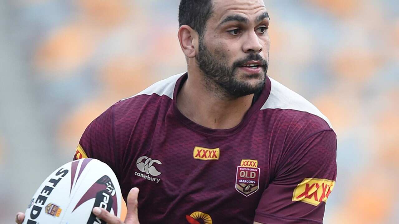 Greg Inglis look on during the Queensland State of Origin