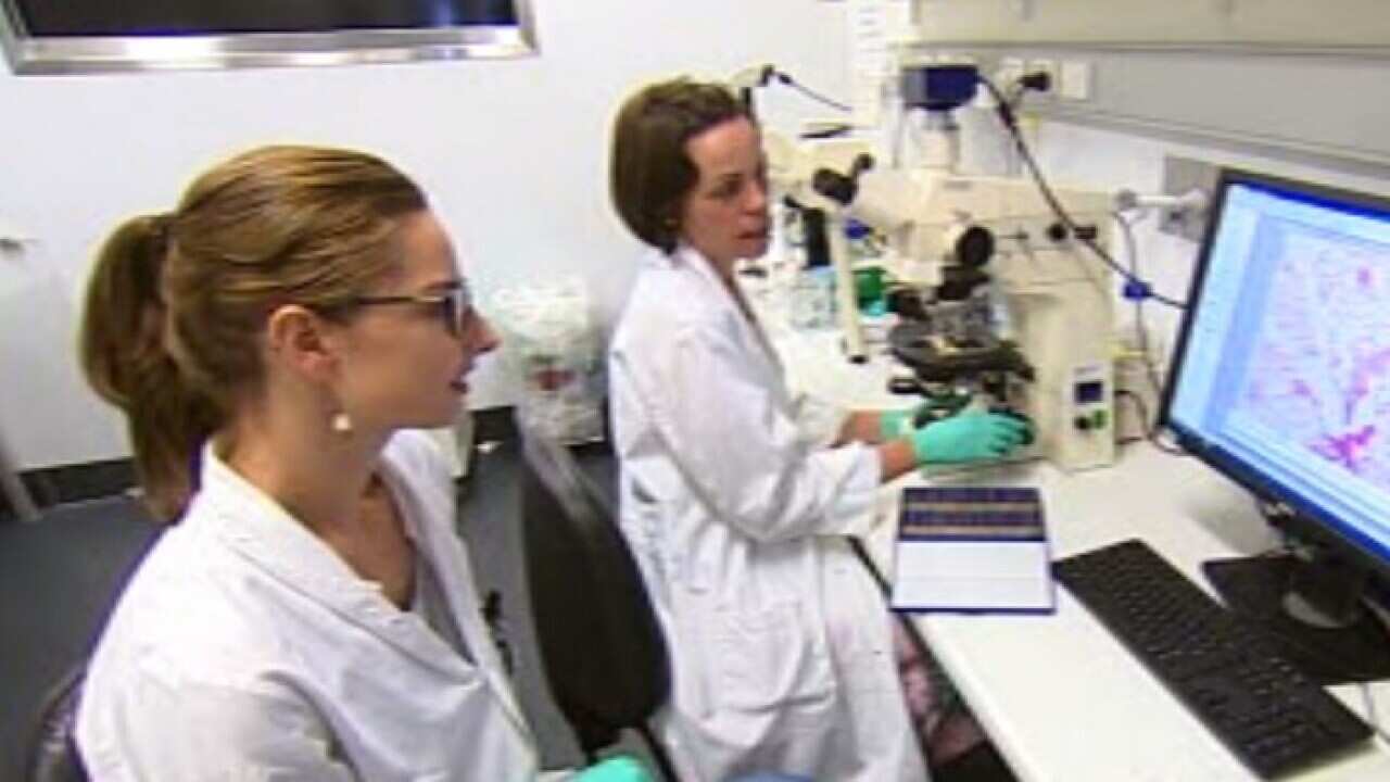 Doctors studying test results