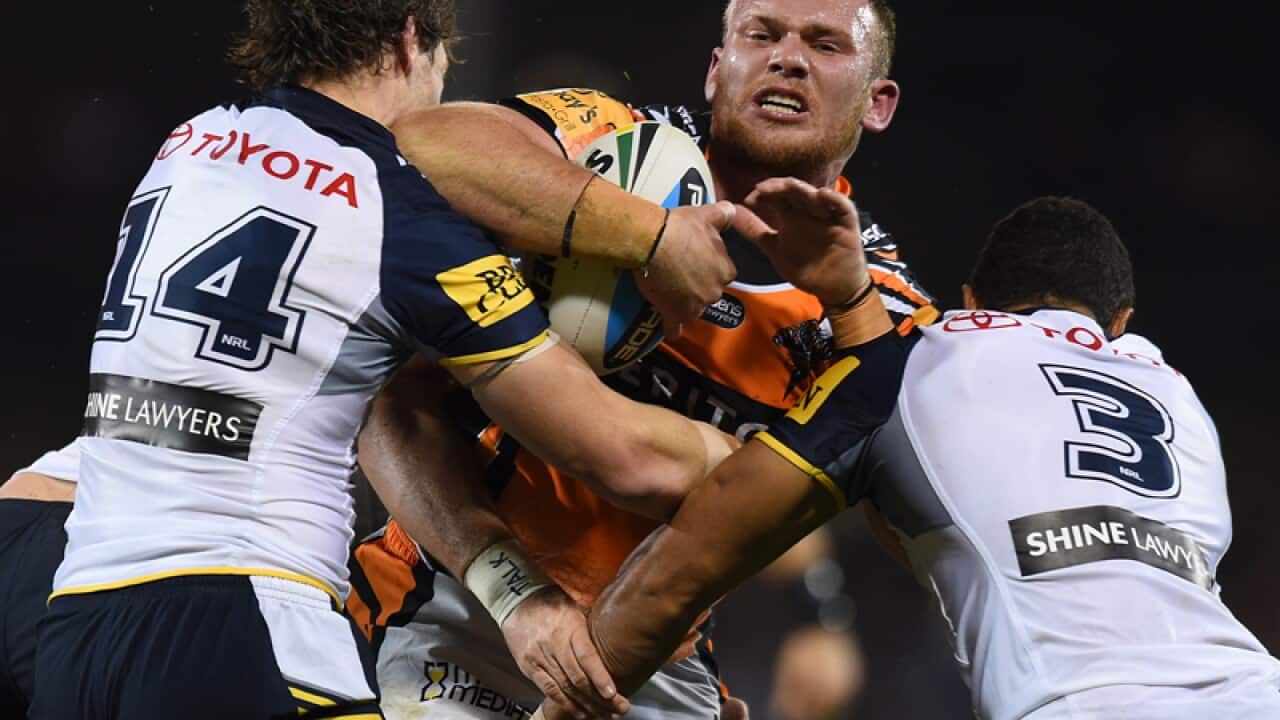 Former Wests Tigers prop Matthew Lodge (C)