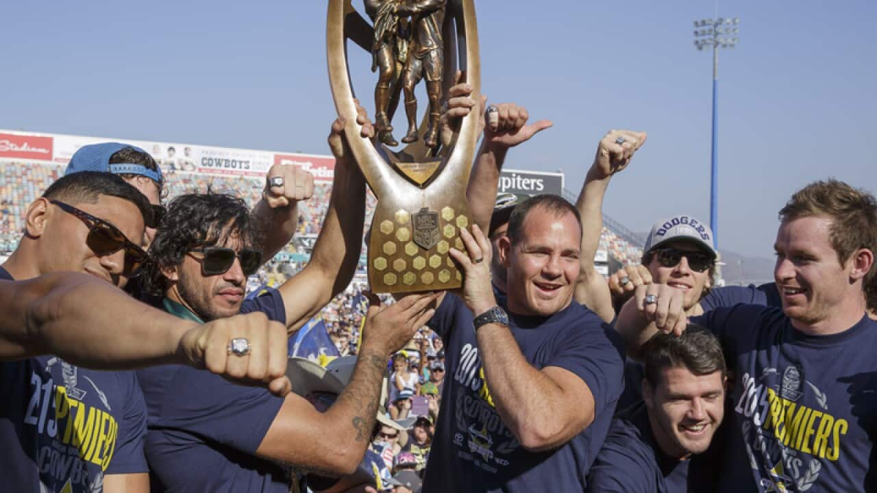 North Queensland Cowboys players with the NRL premiership trophy