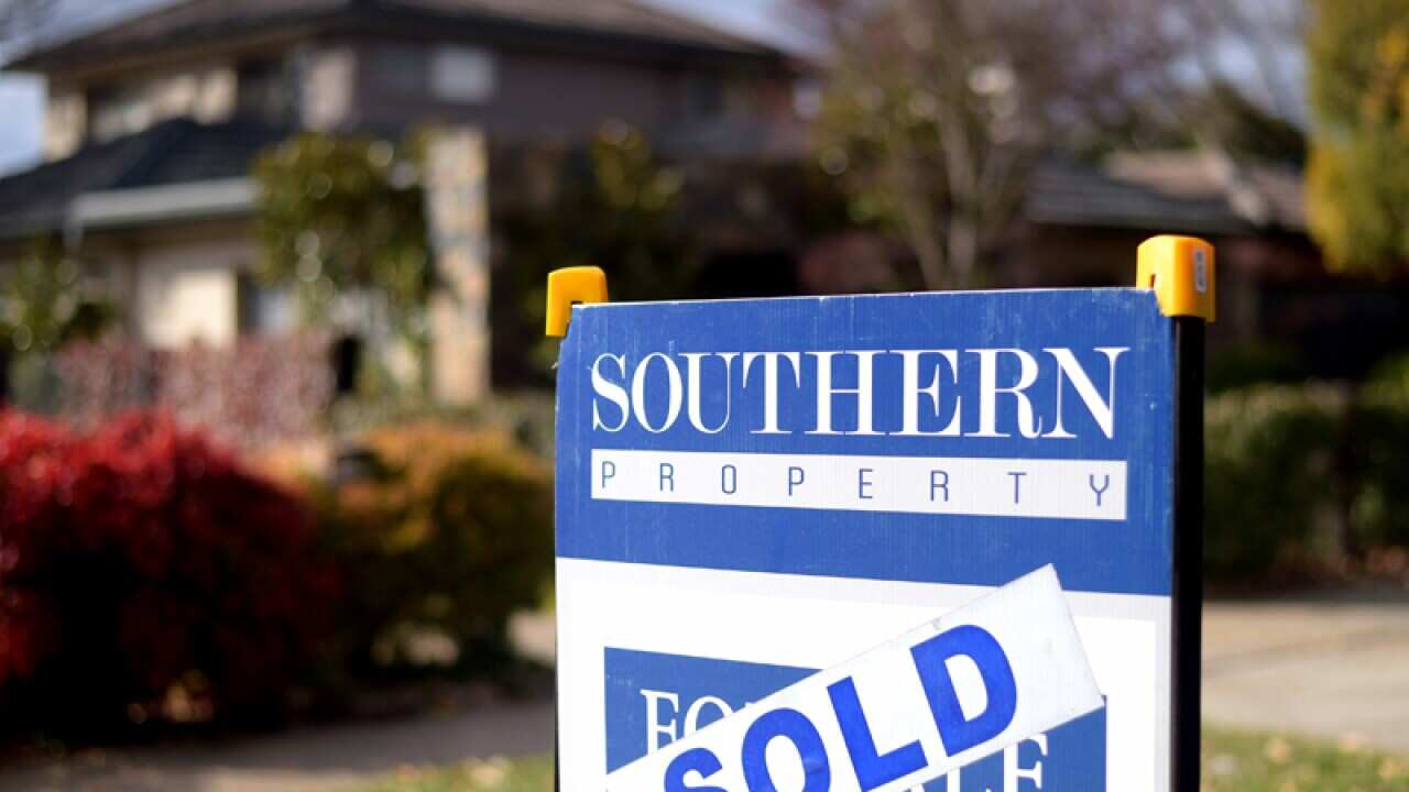 A sold sing outside a house in Canberra