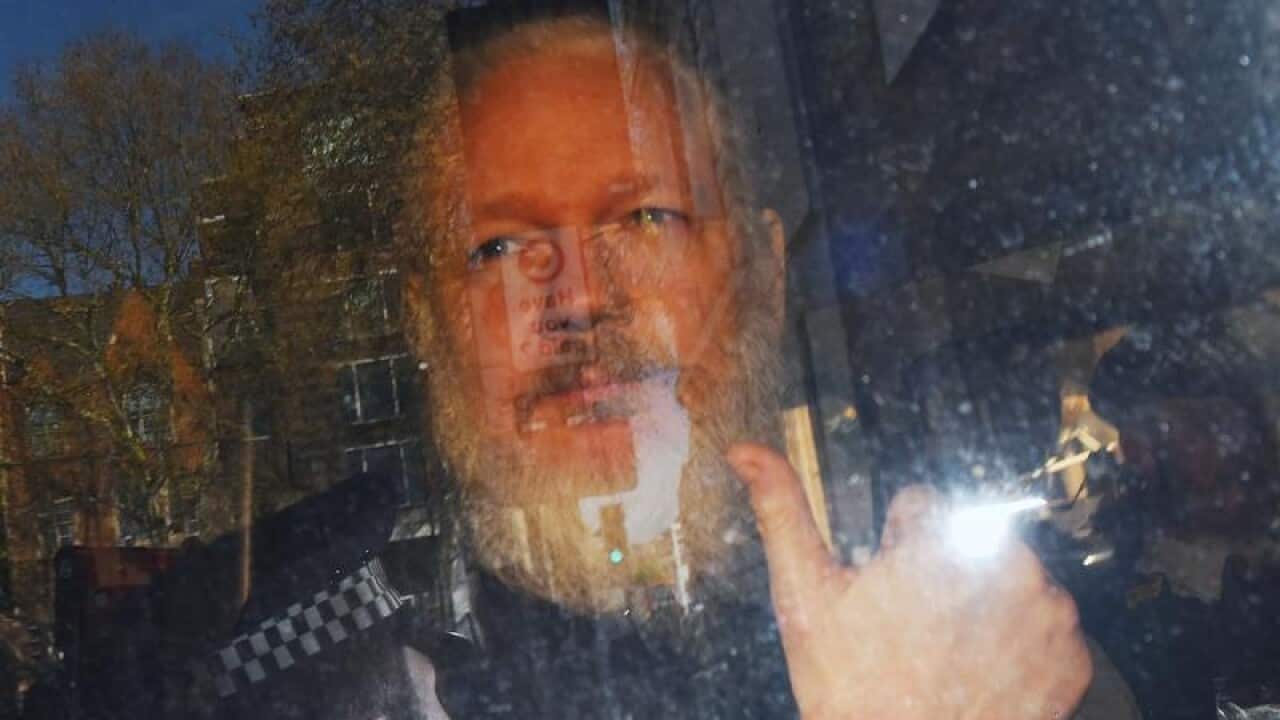 Julian Assange following his arrest.